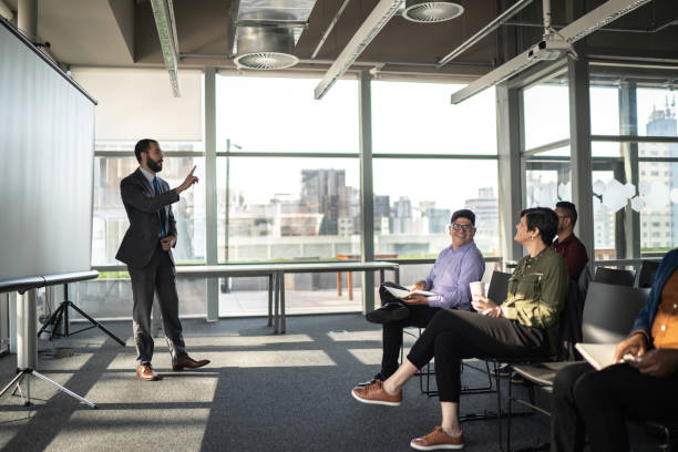 istock Business people attending a seminar with social distancing 1257943055