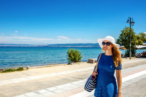istock Carefree young woman at beach 1257943253