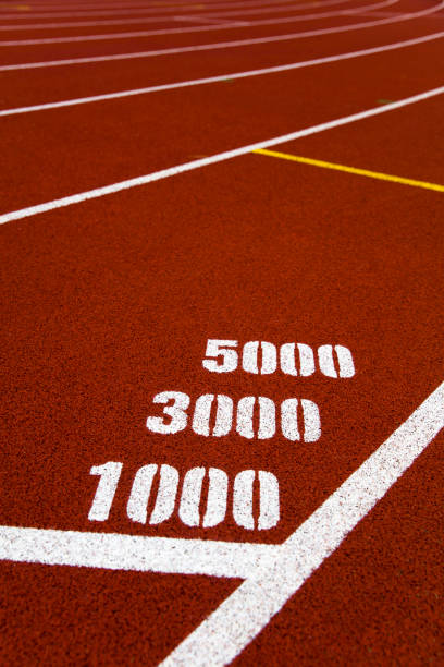 istock Red stadium running track closeup 1257946277