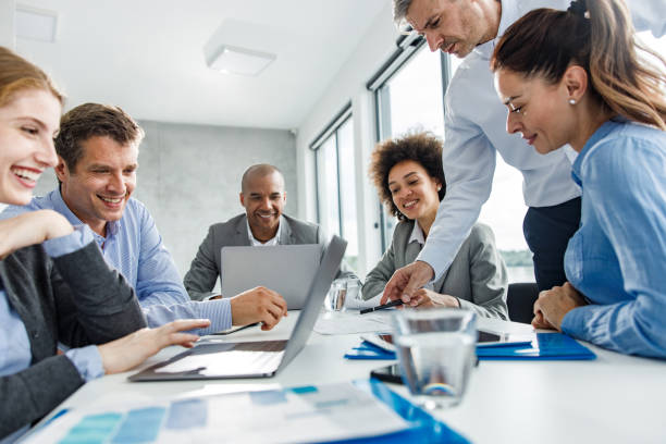 istock Happy business team working on a meeting in the office. 1257947111