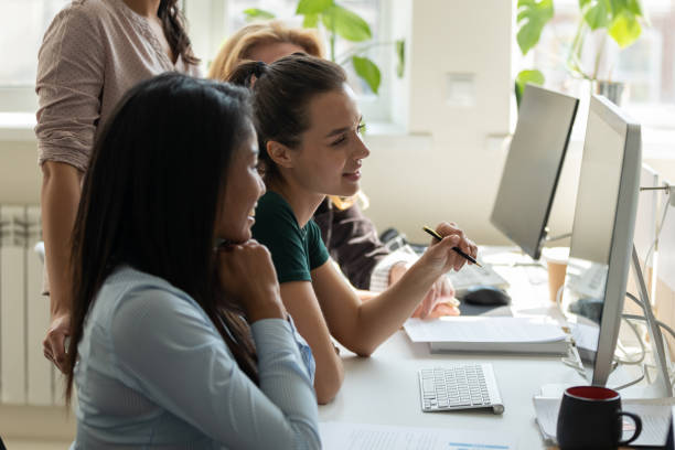istock Diverse happy businesswomen thinking in negotiations looking at computer screen. 1257948461
