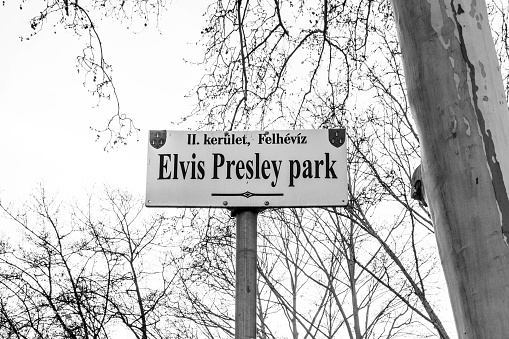 Budapest, Hungary - March 29, 2019: Black and white photo of Elvis Presley park sign in Budapest.