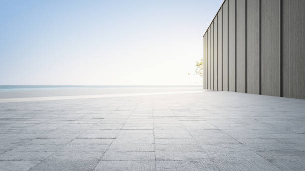 Empty concrete floor and gray wall. 3d rendering of sea view plaza with clear sky background. courtyard stock pictures, royalty-free photos & images