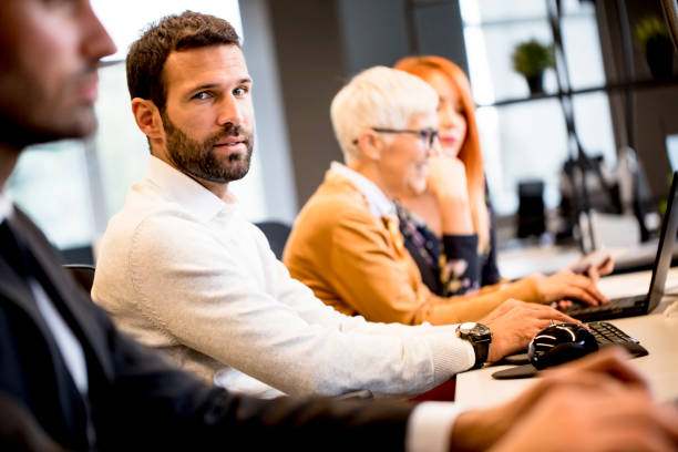 istock Young professional businessman uses a computer for work in the office 1257954346