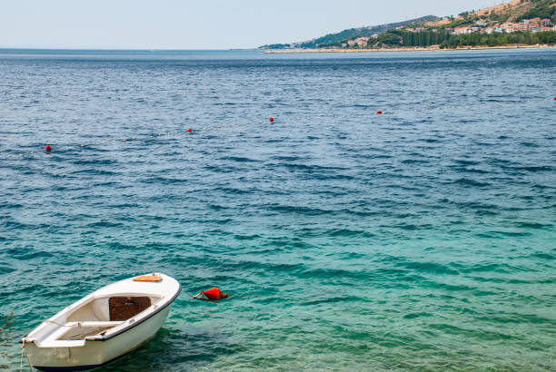 istock Motor boat is anchored near seashore 1257954419