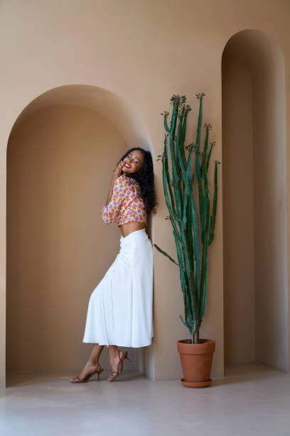 istock Smiling a female model posing indoors. 1257954925