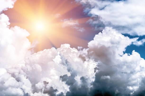 istock dark, grey and white storm clouds and sun 1257954969