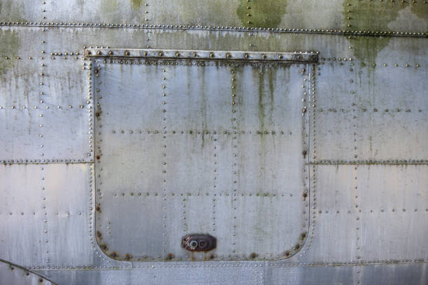 istock Old Aircraft Metal Covering tiles Texture 1257956595