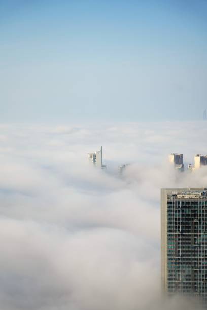 istock Top aerial view on city district over clouds 1257957054
