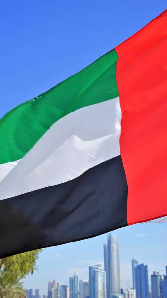 istock Waving UAE flag by skyscrapers 1257957292