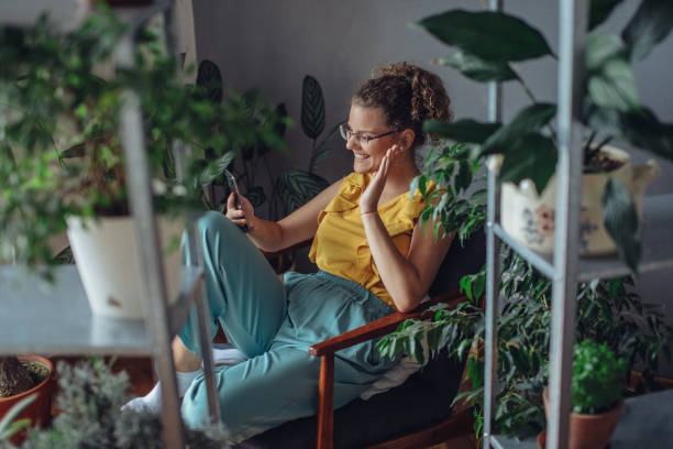 istock Young woman using mobile phone. 1257957422