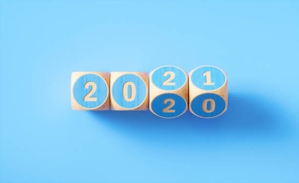 istock 2020 2021 Written Blue Wood Blocks Sitting on Blue Background 1257959108