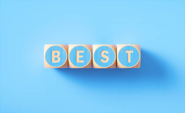 istock Best Written Blue Wood Blocks Sitting on Blue Background 1257959445