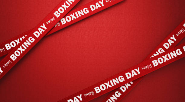 Happy Boxing Day written red ribbons over red background. Horizontal composition with copy space. Boxing Day concept.