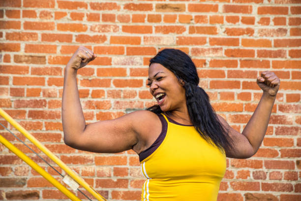 woman strength, determination, healthy lifestyle - body positive imagens e fotografias de stock