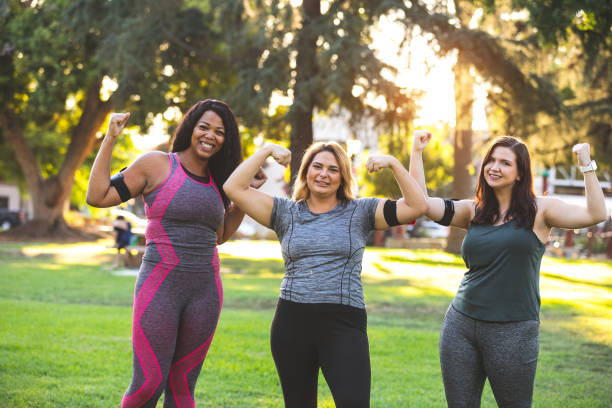 istock Young women jogging and working out at the park 1257964493