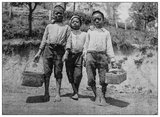 Antique black and white photo: Group of children in Southern USA Antique black and white photo: Group of children in Southern USA social history photos stock illustrations