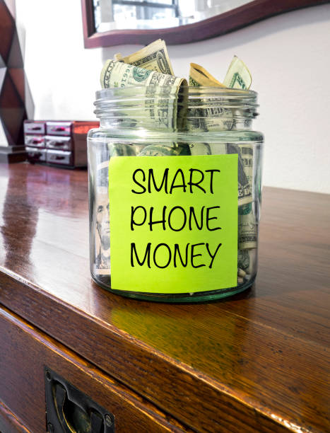 istock Saving money for smart phone 1257969448