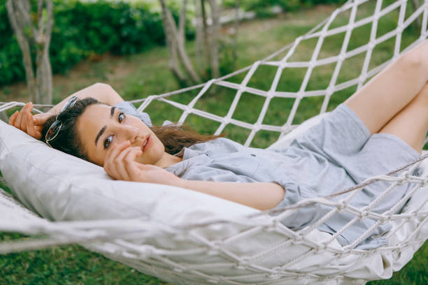 istock Lie on the hammock in the garden 1257975641