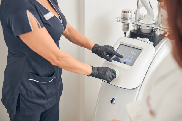 istock Woman in special gear arranging procedure on device 1257975923