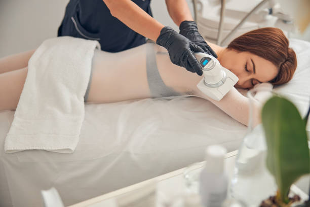 istock Professional beautician in gloves working with her client 1257976002