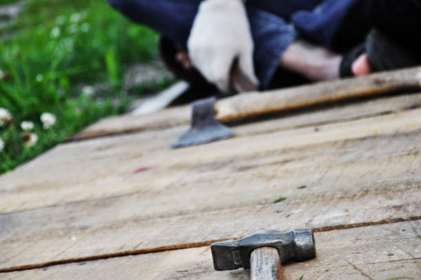 istock repair work in the garden, selective focus on hammer 1257976015