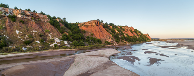 The Cimarron River and this bluff were photographed at sunrise near the town of Freedom, Oklahoma.