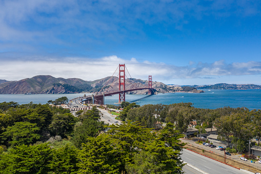 The Golden Gate Bridge span across to San Francisco City, as clouds move over the skyline. A popular tourist destination in the Bay Area, California