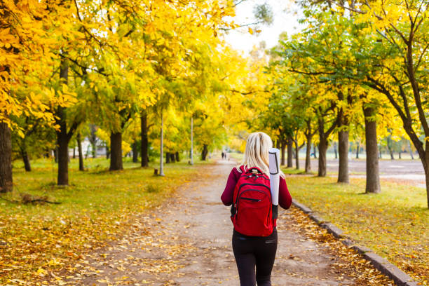 istock Cup with hot coffee or tea on an autumn yellow leaf 1257978156