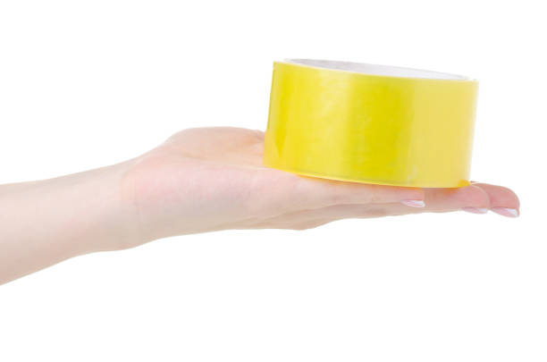 istock Hand holding Scotch tape 1257982810