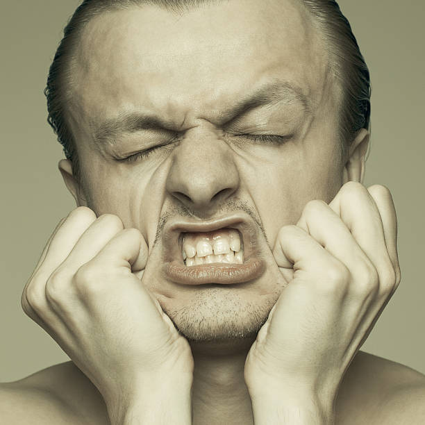 istock portrait of a man stretching his face 125798474