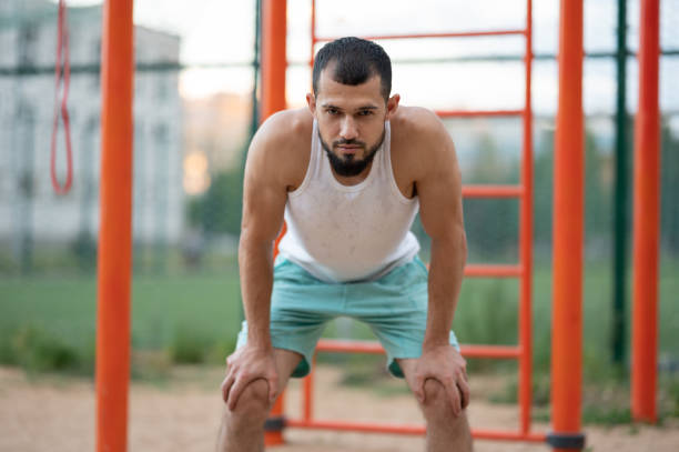 istock Man was tired after training. The athlete regains his breath 1257987088