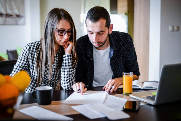 istock Young couple works from home 1257990189