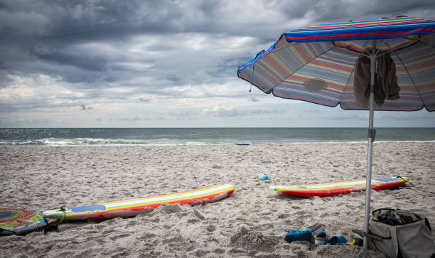 istock Surfboards and Beach Umbrella 1257990378