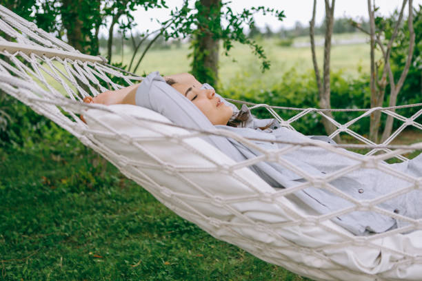 istock Lie on the hammock in the garden 1257991567