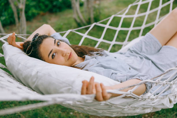 istock Lie on the hammock in the garden 1257991626