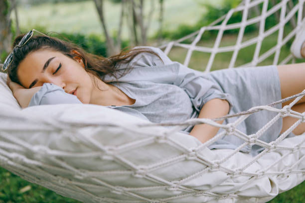 istock Lie on the hammock in the garden 1257991737