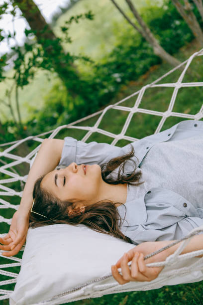 istock Lie on the hammock in the garden 1257991791