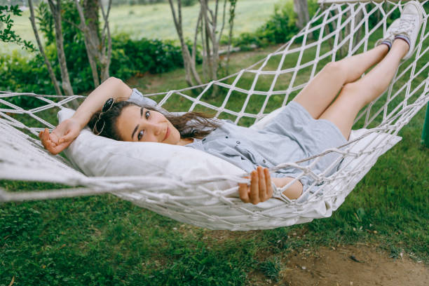 istock Lie on the hammock in the garden looking at camera 1257991860