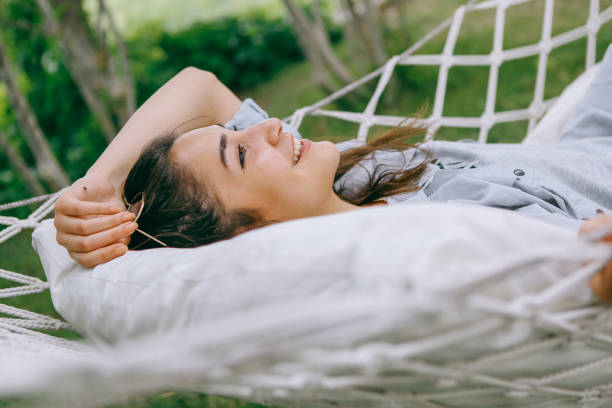 istock young woman in hammock smiling 1257991912