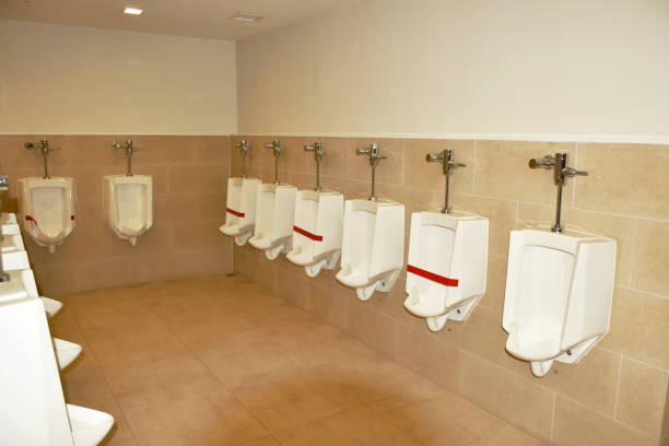 istock standing urinal with red sticker tape for social or physical distancing in coronavirus COVID-19 situation on public toilet floor 1257992425