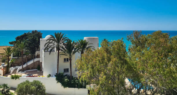 istock House next to the beach 1257994379