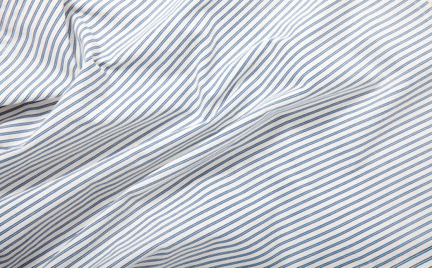 istock White and blue striped fabric texture with creased folds 1258001152