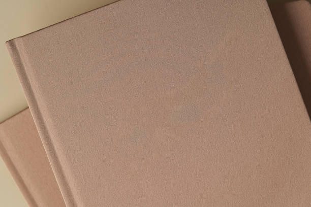 istock Blank book cover on pastel color background with copy space 1258001539
