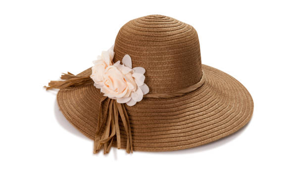 istock Pretty straw hat with ribbon and bow on white background. Beach hat top view isolated 1258002357