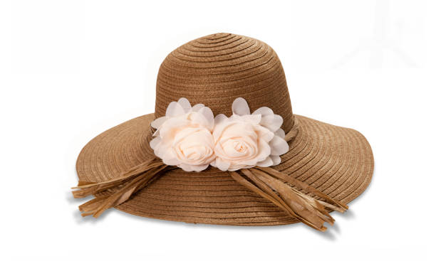 istock Pretty straw hat with ribbon and bow on white background. Beach hat top view isolated 1258002358