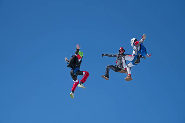 istock Freefall jumpers soar above mountain landscape 1258002549