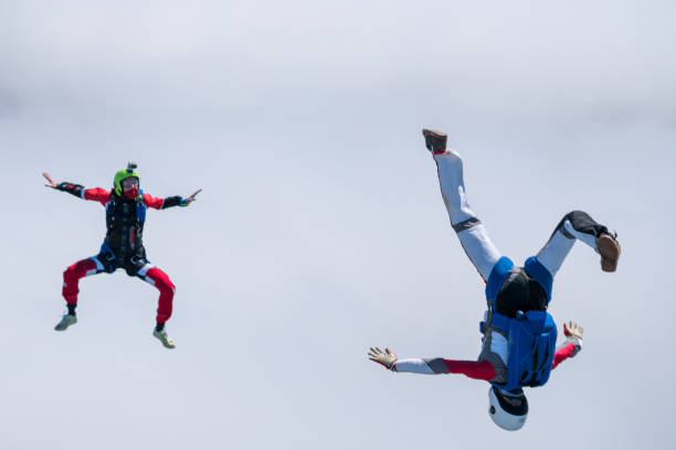 istock Freefall jumpers soar above mountain landscape 1258002684