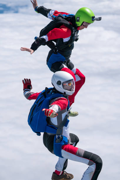 istock Freefall jumpers soar above mountain landscape 1258002685