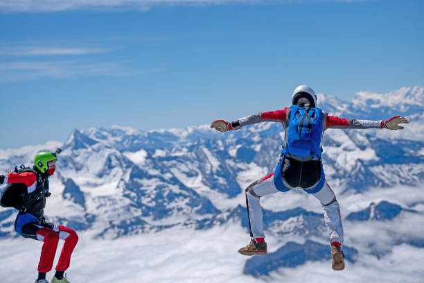 istock Freefall jumpers soar above mountain landscape 1258002707